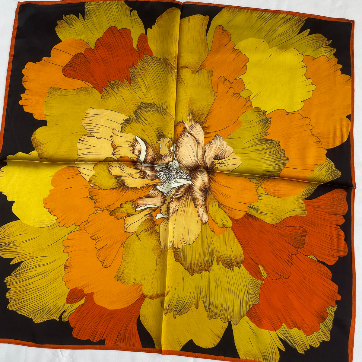 Closer view of the layered yellow and orange petals on The Golden Flowers scarf