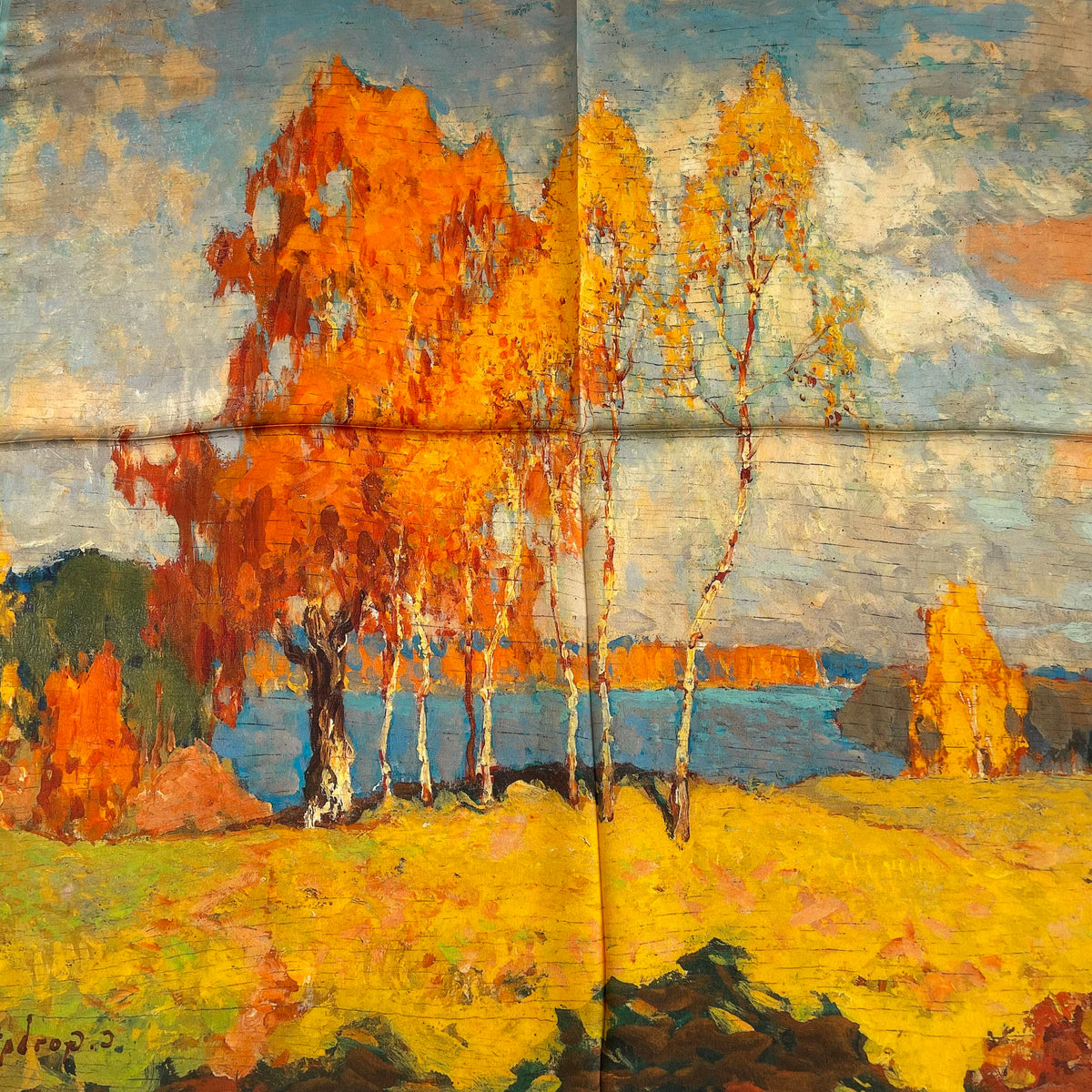 Close-up of the orange trees and blue landscape printed on The Autumn Painting silk scarf